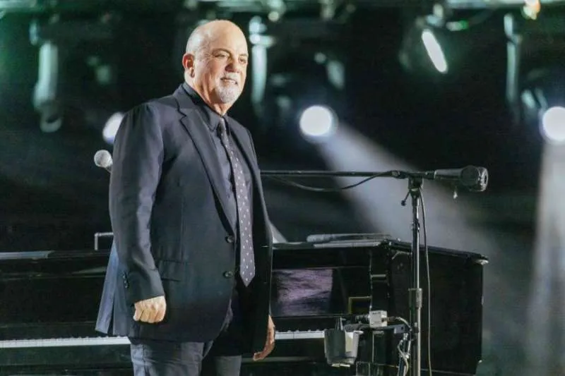 Billy Joel Misses Film Premiere After Brain Disorder Diagnosis, But Vows “I’ll Be Back”